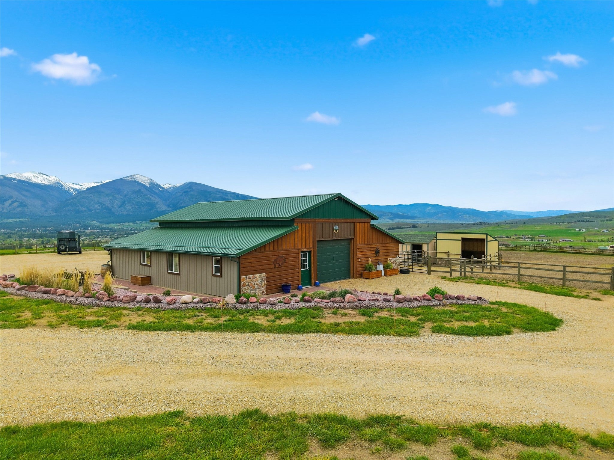 679 Hidden Valley Road North Florence, MT 59833 - Photo 51 of 85 Barn structure featuring a green metal roof and wood siding