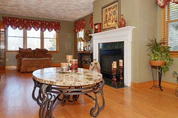 201 Andover Street Georgetown, MA 01833 - Photo 15 of 30 a living room with furniture and a fireplace