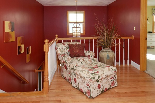 201 Andover Street Georgetown, MA 01833 - Photo 20 of 30 a bedroom with a large bed and wooden floor
