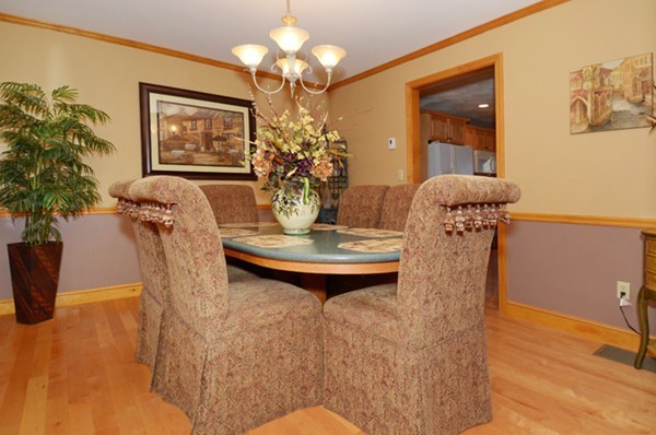 201 Andover Street Georgetown, MA 01833 - Photo 21 of 30 a view of a dining room with furniture and chandelier