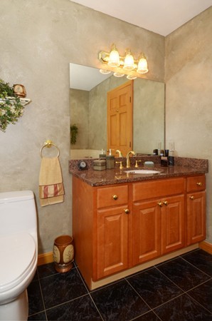 201 Andover Street Georgetown, MA 01833 - Photo 25 of 30 a bathroom with a sink toilet and mirror