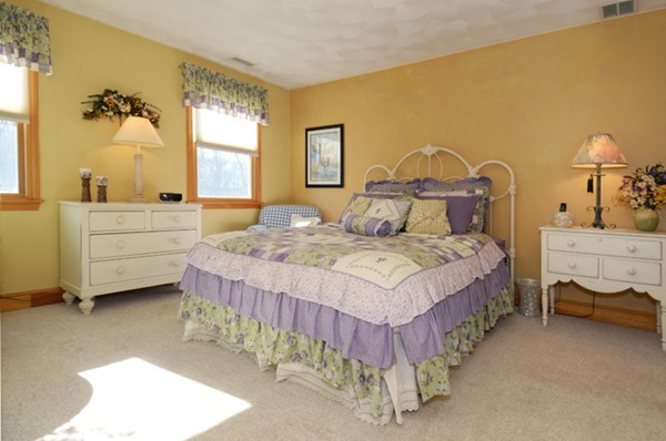201 Andover Street Georgetown, MA 01833 - Photo 26 of 30 a spacious bedroom with a bed and a table