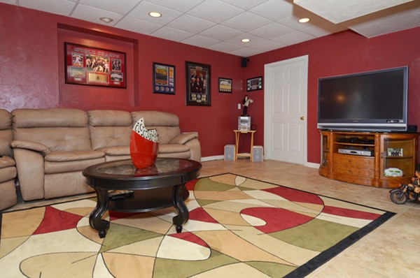 201 Andover Street Georgetown, MA 01833 - Photo 30 of 30 a living room with furniture and a flat screen tv