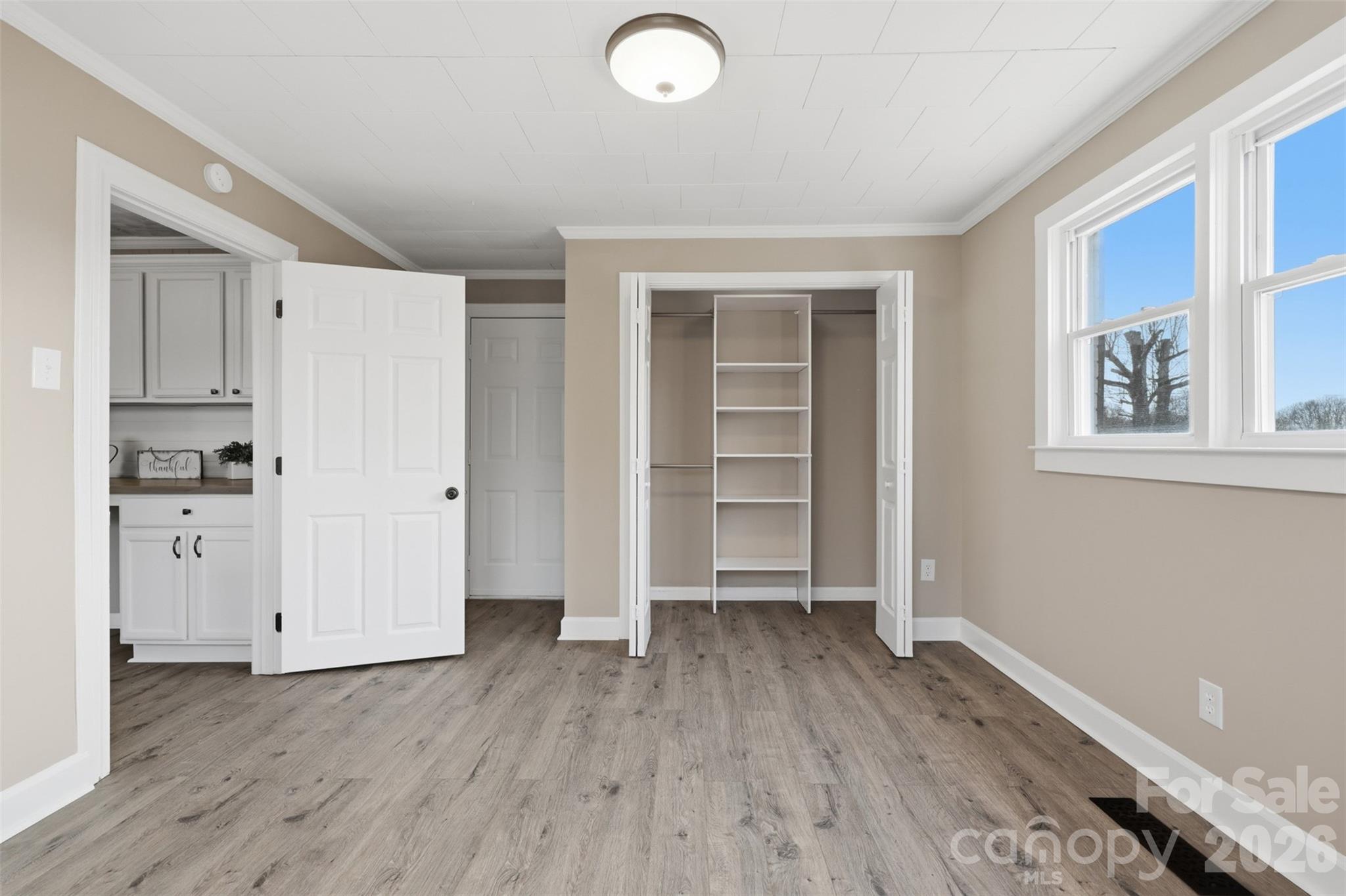 100 Boston Road Taylorsville, NC 28681 - Photo 18 of 41 an empty room with wooden floor and windows