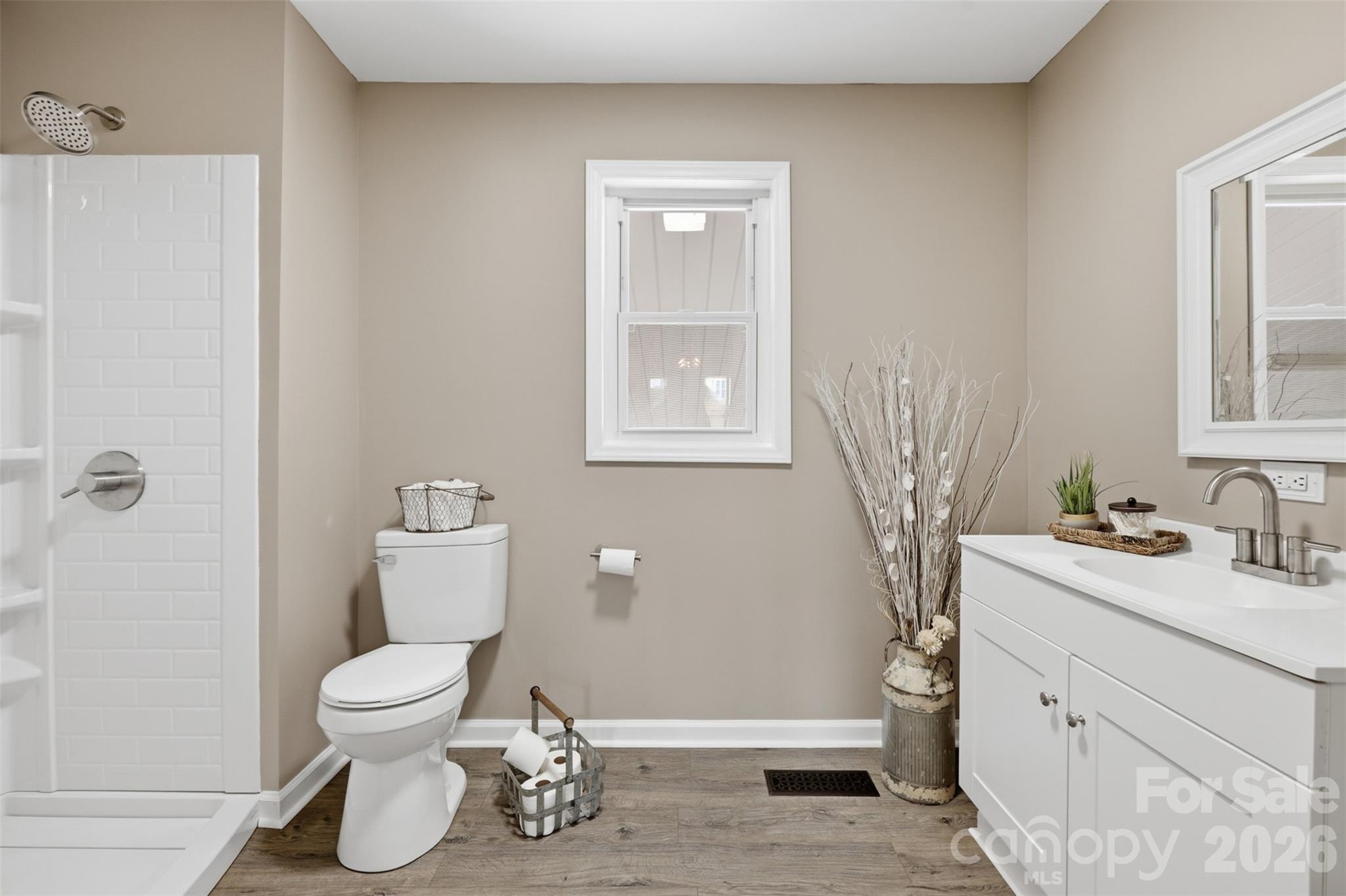 100 Boston Road Taylorsville, NC 28681 - Photo 21 of 41 a white toilet sitting next to a bathroom sink