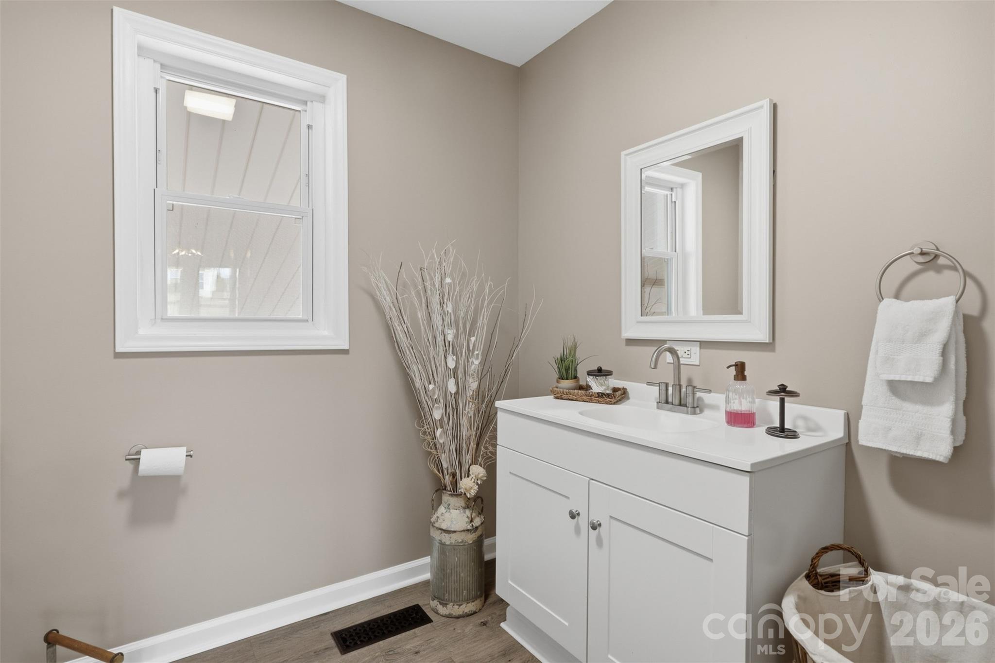 100 Boston Road Taylorsville, NC 28681 - Photo 22 of 41 a bathroom with a sink vanity and a mirror