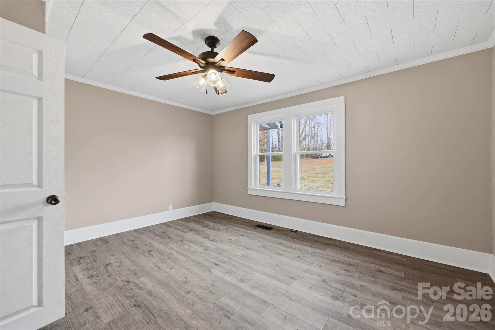 100 Boston Road Taylorsville, NC 28681 - Photo 24 of 41 a view of an empty room with wooden floor and a window