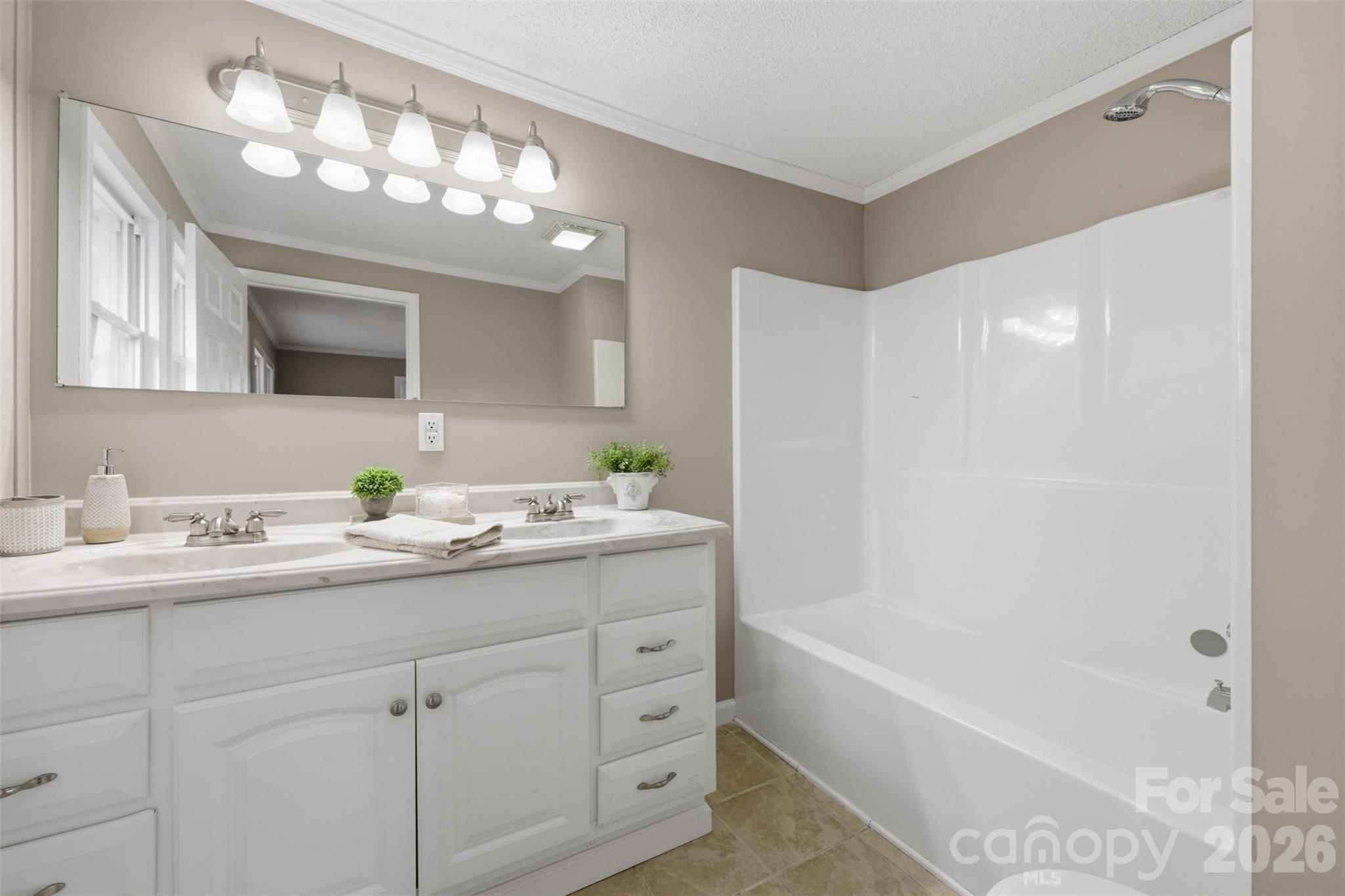 100 Boston Road Taylorsville, NC 28681 - Photo 30 of 41 a bathroom with a tub a sink and mirror