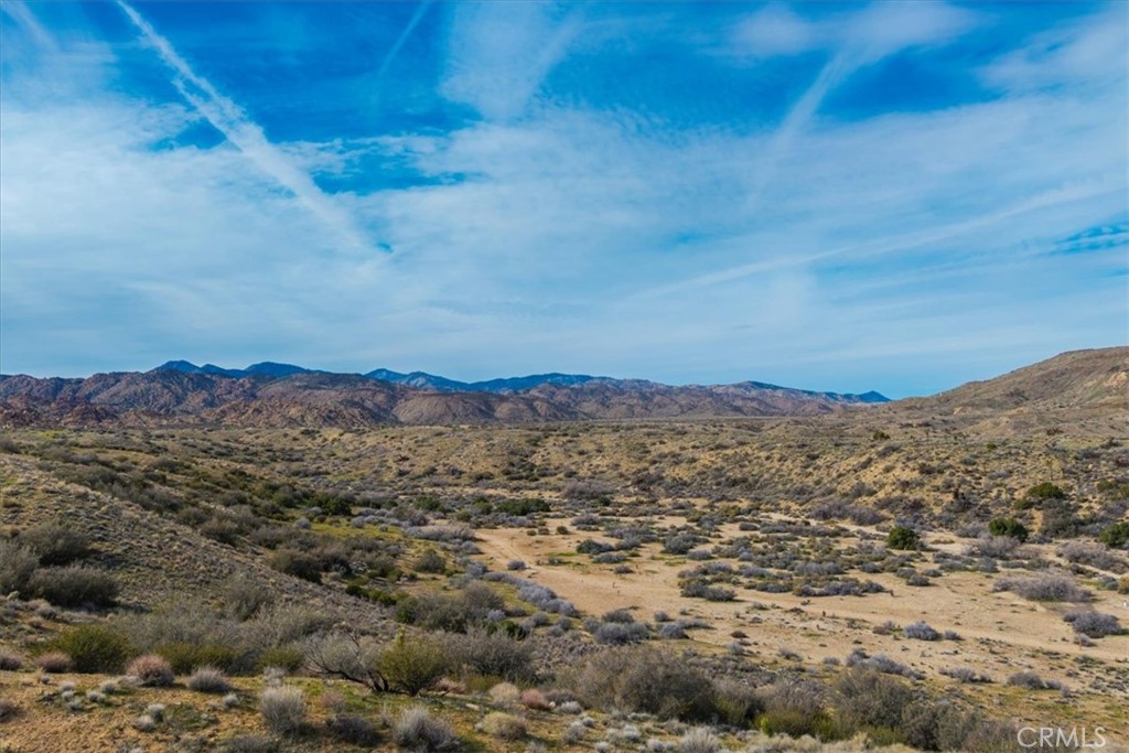 5190 Pioneertown Road Pioneertown, CA 92268 - Photo 11 of 30 a view of a large building with mountains in the background