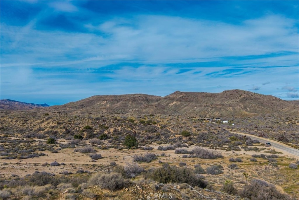 5190 Pioneertown Road Pioneertown, CA 92268 - Photo 13 of 30 a view of a large mountain with mountains in the background