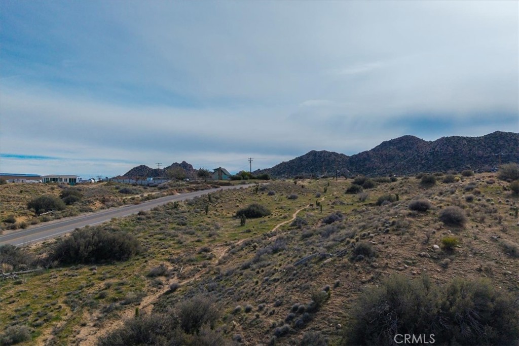 5190 Pioneertown Road Pioneertown, CA 92268 - Photo 16 of 30 a view of a large building with mountains in the background