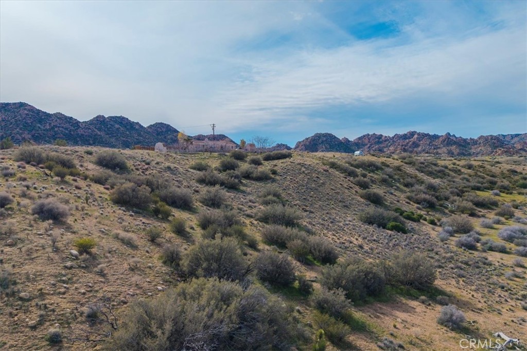 5190 Pioneertown Road Pioneertown, CA 92268 - Photo 17 of 30 a view of a houses with a yard