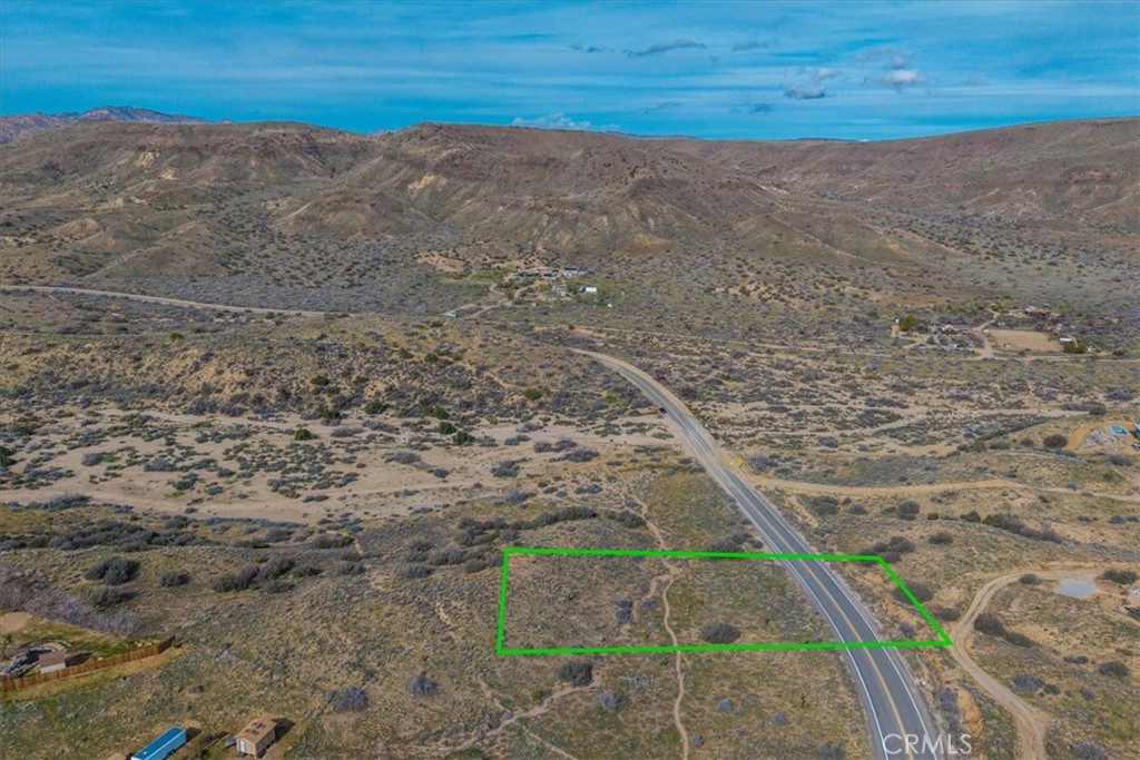 5190 Pioneertown Road Pioneertown, CA 92268 - Photo 2 of 30 a view of a dry yard with wooden fence