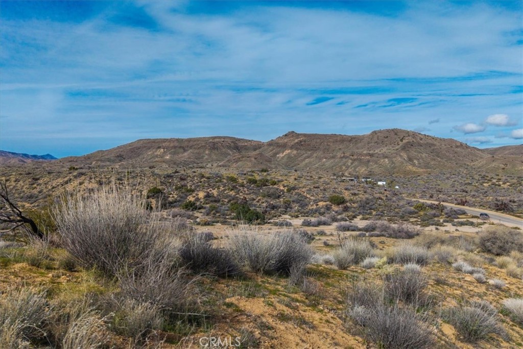 5190 Pioneertown Road Pioneertown, CA 92268 - Photo 22 of 30 a view of a large mountain with mountains in the background