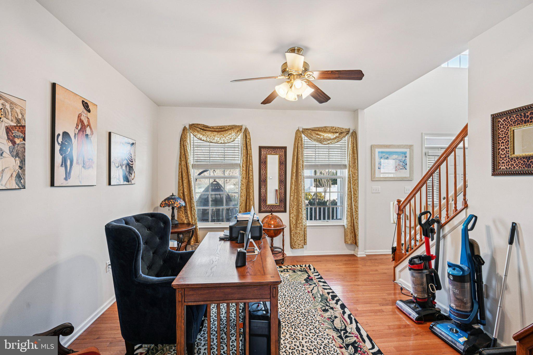 207 Waterford Road Egg Harbor Township, NJ 08234 - Photo 13 of 47 a view of a livingroom with furniture entryway wooden floor and a chandelier