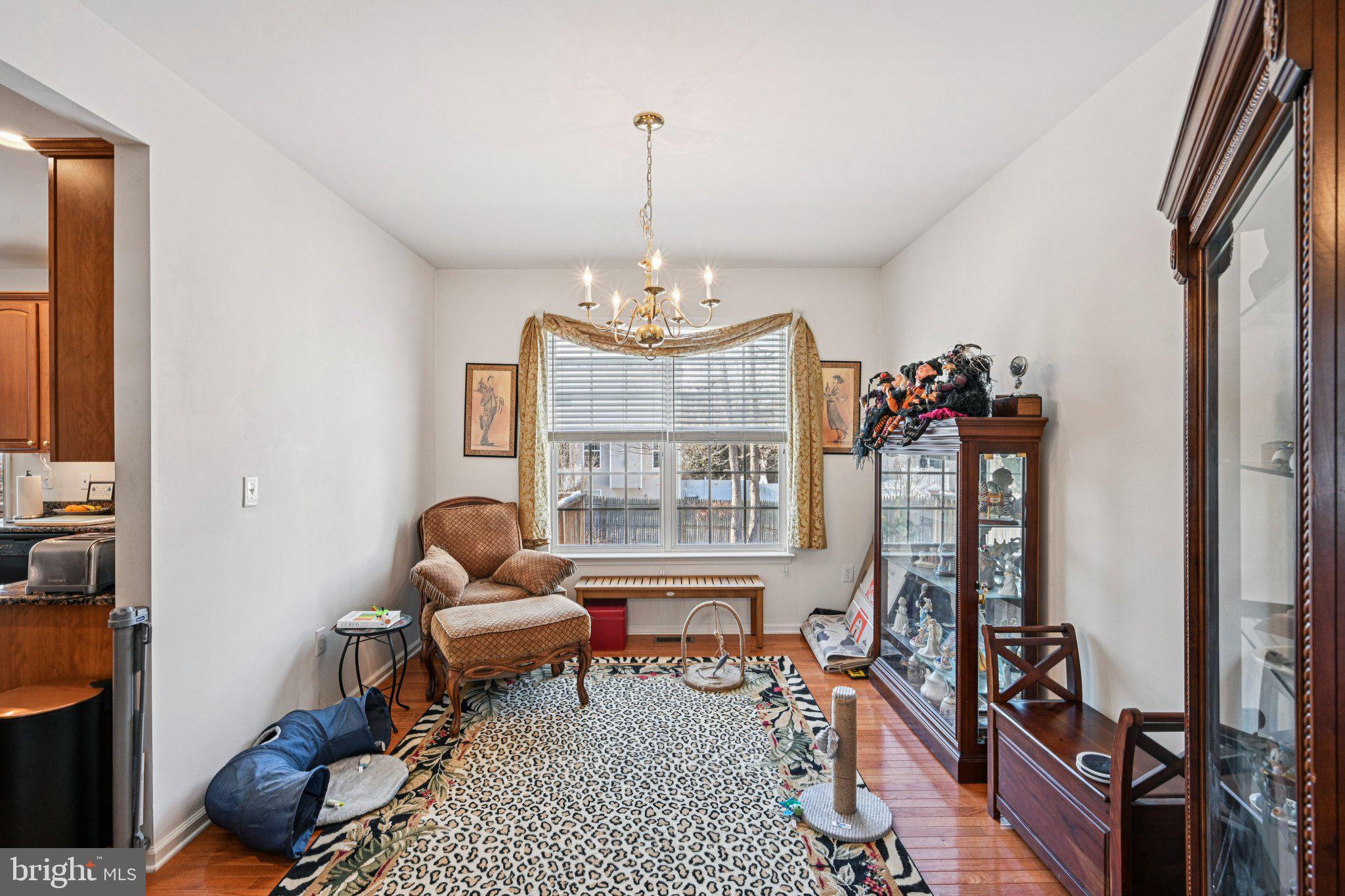 207 Waterford Road Egg Harbor Township, NJ 08234 - Photo 14 of 47 a living room with furniture a chandelier and a window