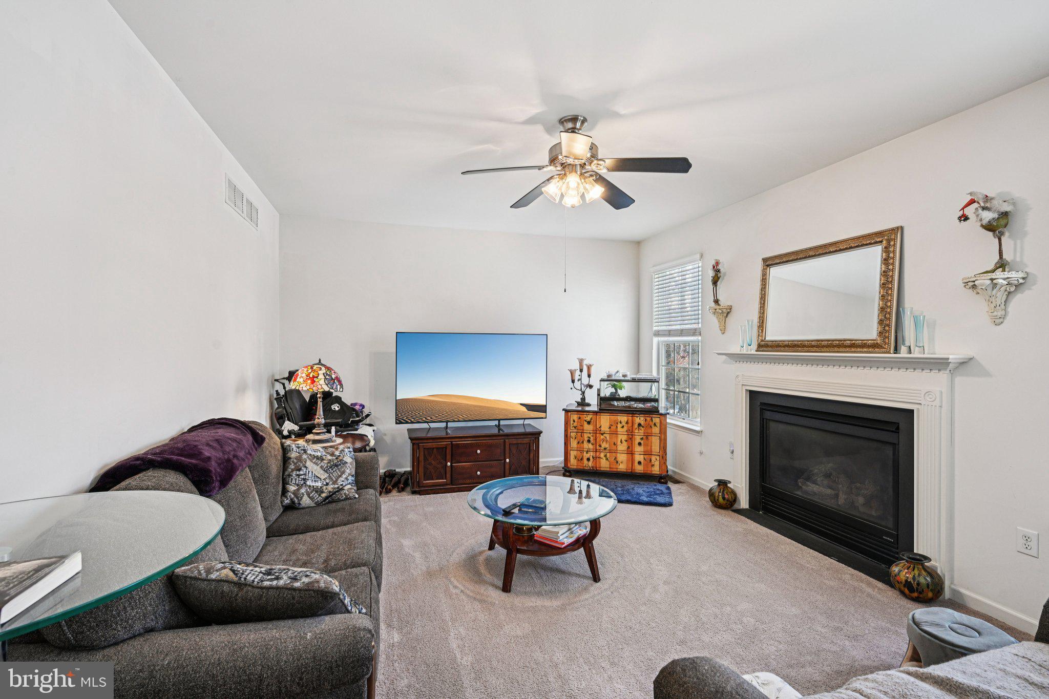 207 Waterford Road Egg Harbor Township, NJ 08234 - Photo 23 of 47 a living room with furniture a fireplace and a flat screen tv