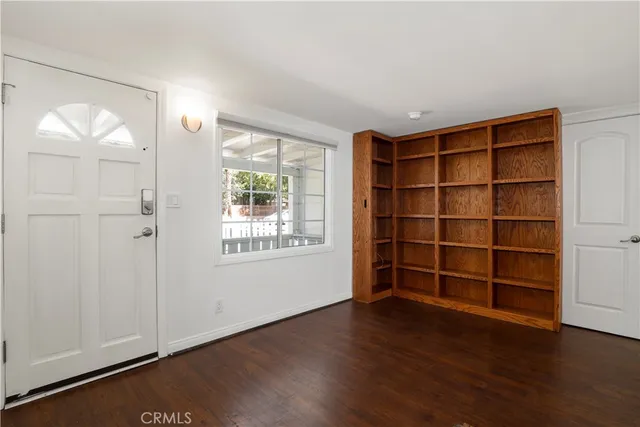 a room with furniture and wooden floor