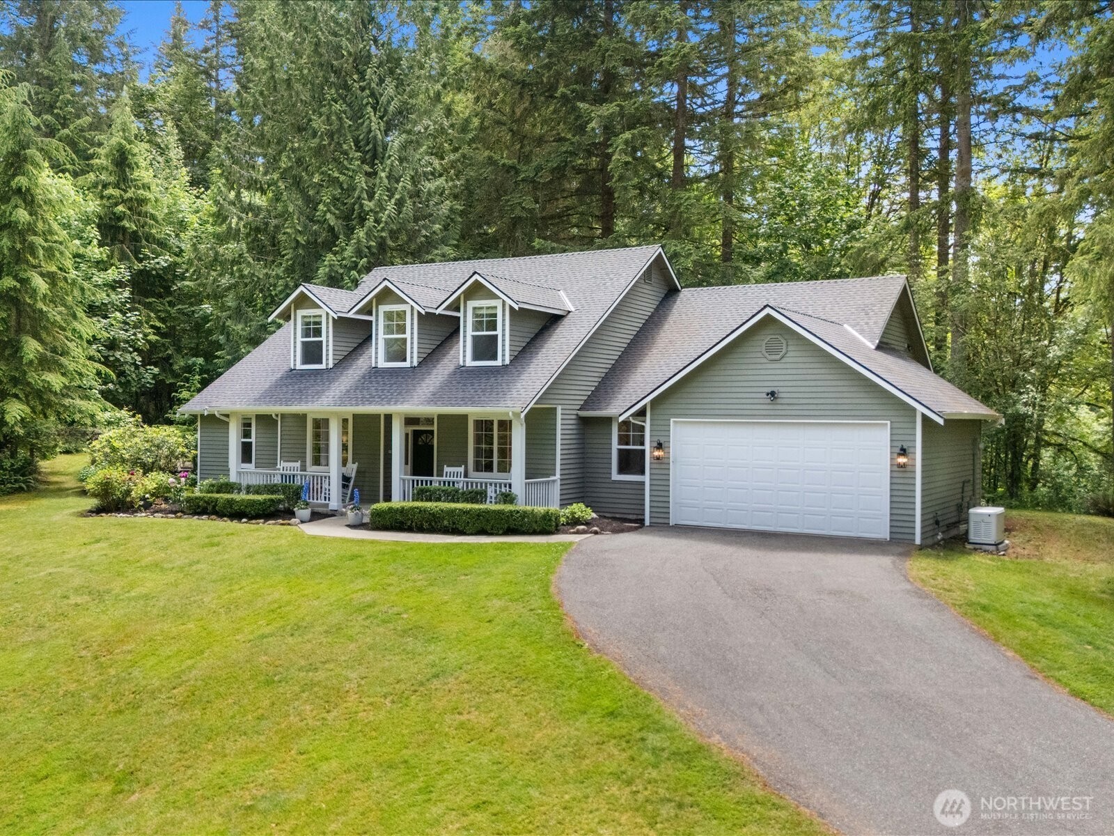 33606 Northeast Lake Joy Road Carnation, WA 98014 - Photo 2 of 40 a front view of a house with yard and green space