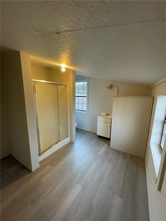 121 Bear Ridge Road Dahlonega, GA 30533 - Photo 12 of 14 a view of a big room with wooden floor and windows