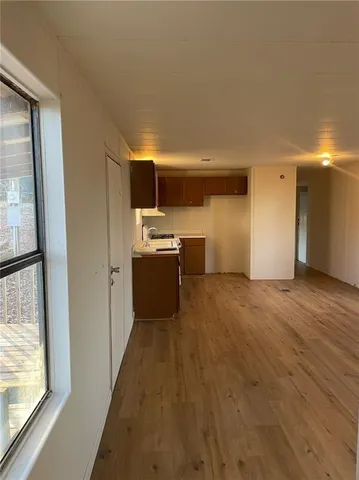 a view of a kitchen with a sink cabinets and a window