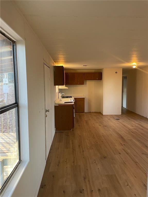 121 Bear Ridge Road Dahlonega, GA 30533 - Photo 3 of 14 a view of a kitchen with a sink cabinets and a window