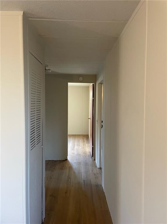 121 Bear Ridge Road Dahlonega, GA 30533 - Photo 6 of 14 a view of a hallway with wooden floor