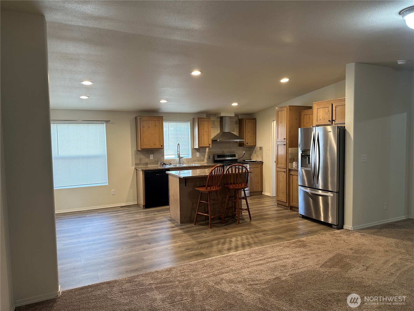 206 Mossyrock Road West Mossyrock, WA 98564 - Photo 2 of 24 a kitchen with stainless steel appliances kitchen island granite countertop a refrigerator and a sink