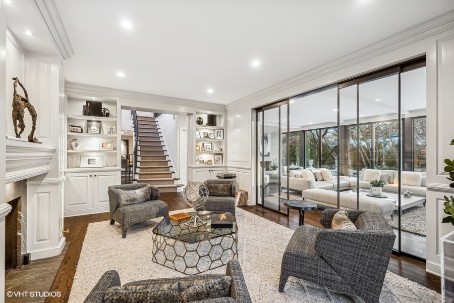 89 North Indian Hill Road Winnetka, IL 60093 - Photo 17 of 91 a living room with furniture large windows and wooden floor