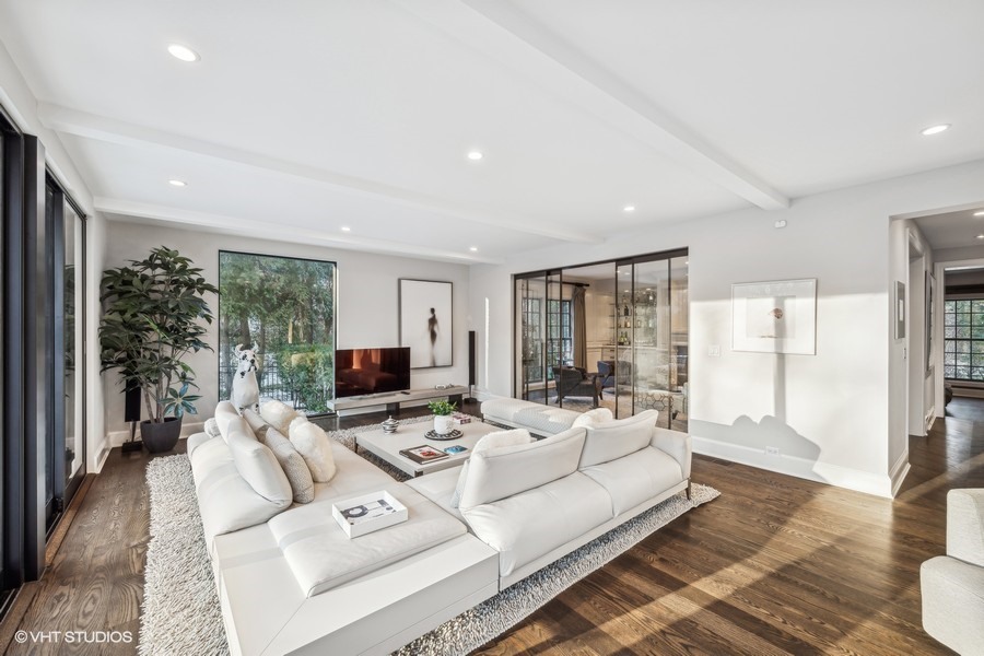 89 North Indian Hill Road Winnetka, IL 60093 - Photo 21 of 91 a living room with furniture large windows and a flat screen tv