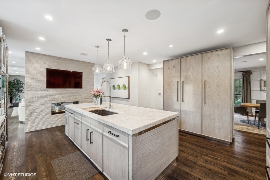 89 North Indian Hill Road Winnetka, IL 60093 - Photo 27 of 91 a kitchen with stainless steel appliances granite countertop a sink and a stove top oven
