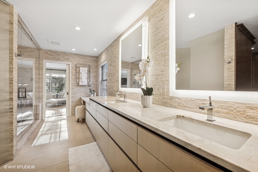 89 North Indian Hill Road Winnetka, IL 60093 - Photo 40 of 91 a large bathroom with a double vanity sink and a large mirror