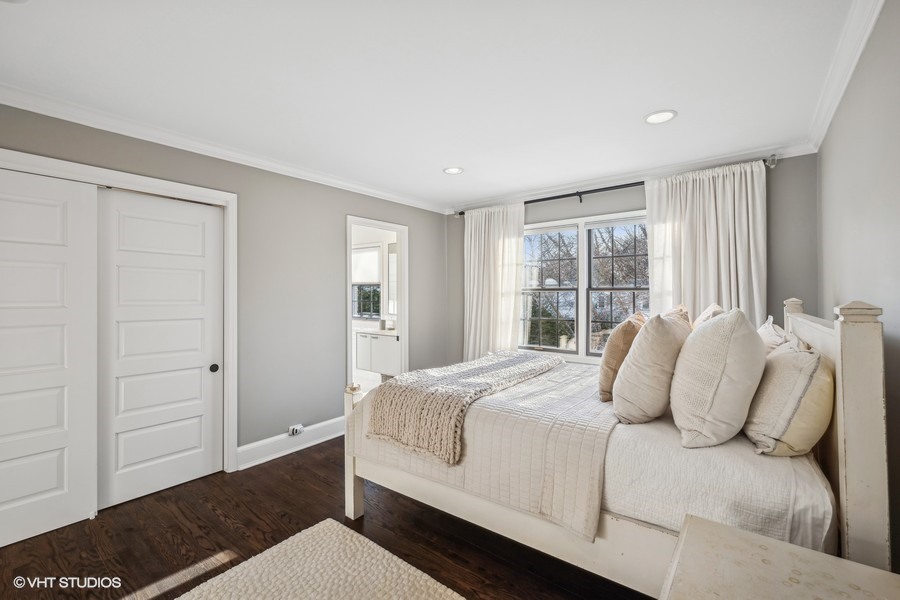 89 North Indian Hill Road Winnetka, IL 60093 - Photo 48 of 91 a bedroom with a large bed and wooden floor