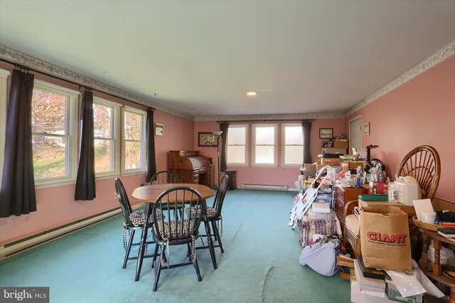 a view of a livingroom with furniture and window