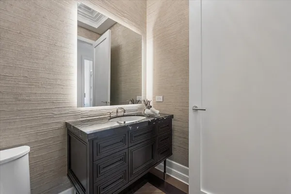 a kitchen with a sink and a mirror