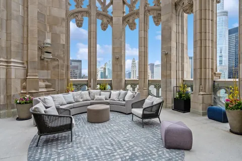 a view of swimming pool with outdoor seating