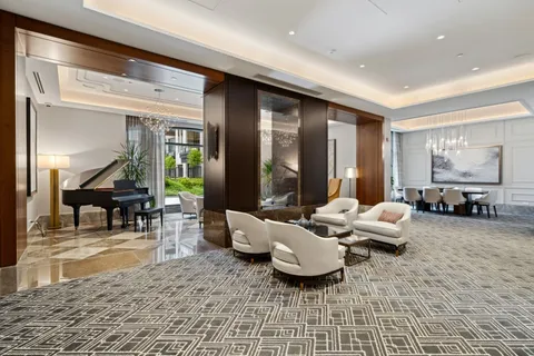 a living room with a large window and a table