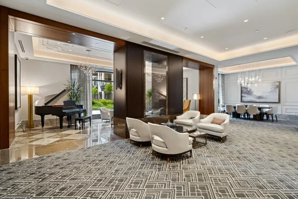 a living room with a large window and a table