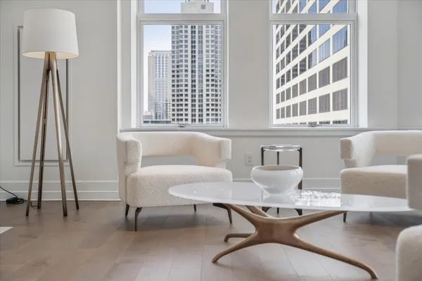 a living room with furniture and a large window