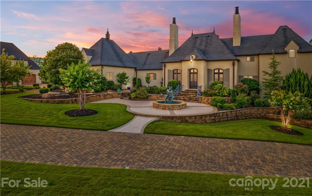383 Silver Ridge Road Mill Spring, NC 28756 - Photo 1 of 46 a front view of a house with garden