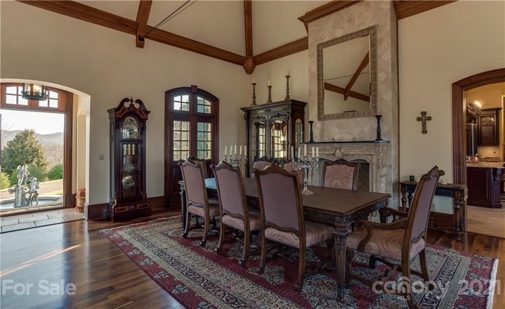 383 Silver Ridge Road Mill Spring, NC 28756 - Photo 11 of 46 a view of a dining room with furniture window and wooden floor