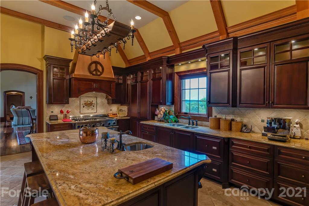 383 Silver Ridge Road Mill Spring, NC 28756 - Photo 13 of 46 a view of a dining room and kitchen