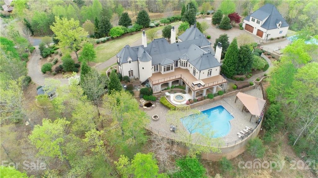 383 Silver Ridge Road Mill Spring, NC 28756 - Photo 3 of 46 an aerial view of residential house with outdoor space and swimming pool