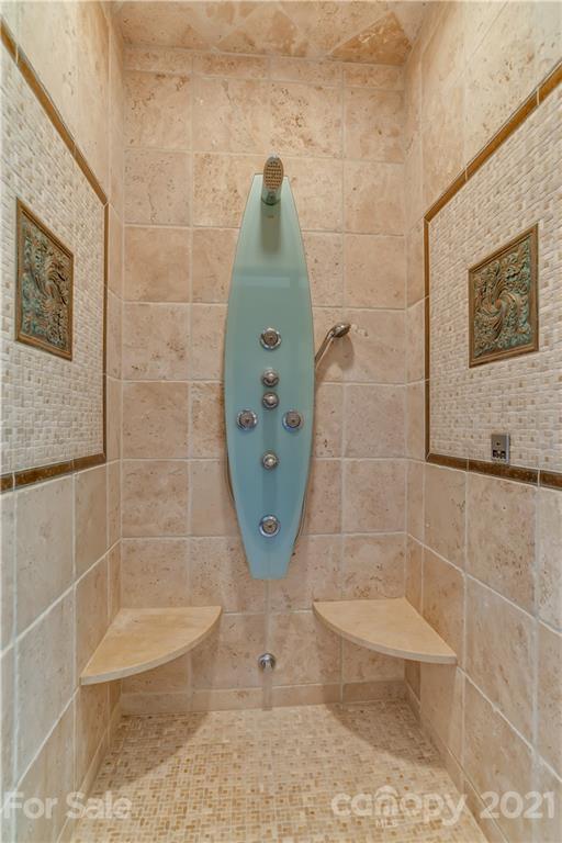 383 Silver Ridge Road Mill Spring, NC 28756 - Photo 24 of 46 a bathroom with a shower