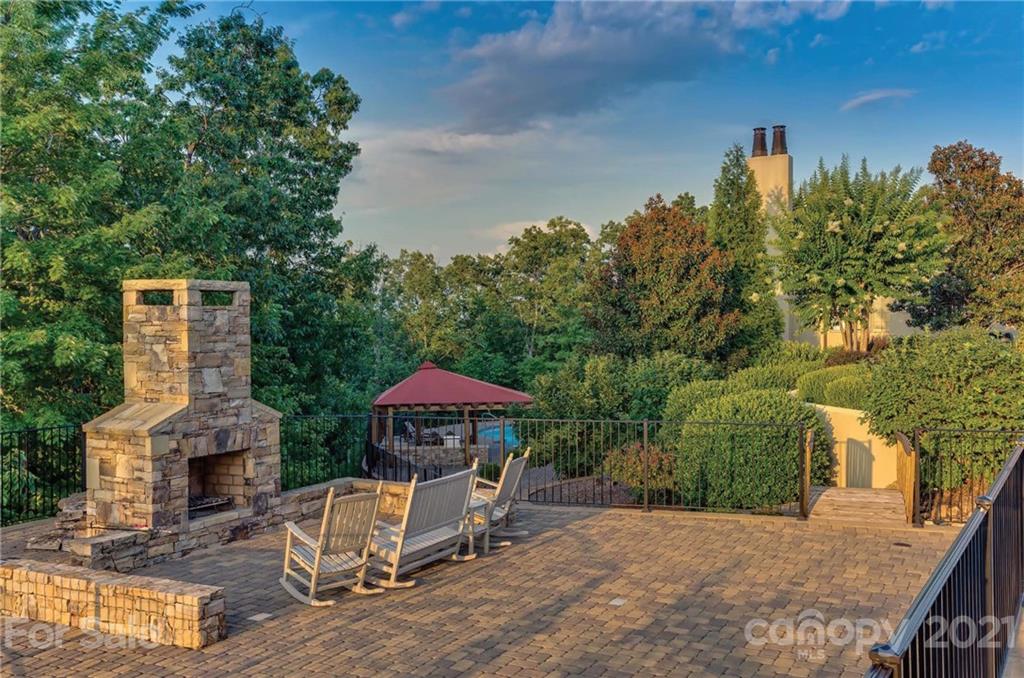 383 Silver Ridge Road Mill Spring, NC 28756 - Photo 35 of 46 an outdoor space with furniture and umbrella