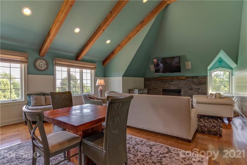 383 Silver Ridge Road Mill Spring, NC 28756 - Photo 39 of 46 a view of a dining room with furniture window and outside view