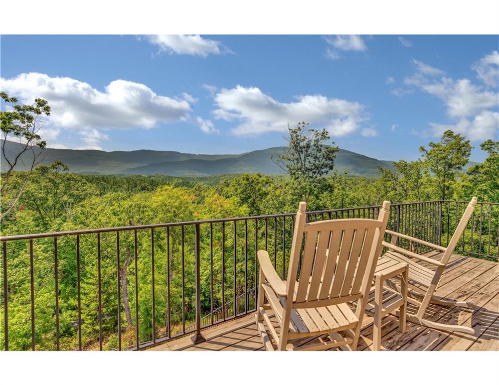 383 Silver Ridge Road Mill Spring, NC 28756 - Photo 41 of 46 a view of a chairs and table on the terrace