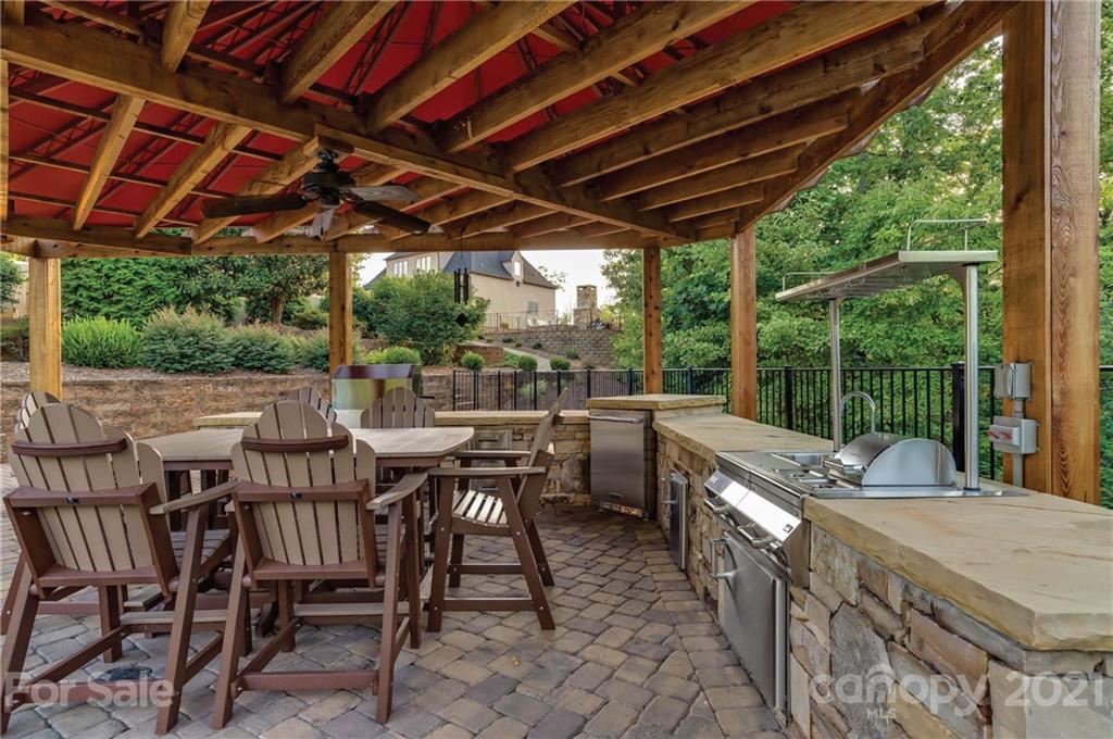 383 Silver Ridge Road Mill Spring, NC 28756 - Photo 45 of 46 a view of a patio with table and chairs