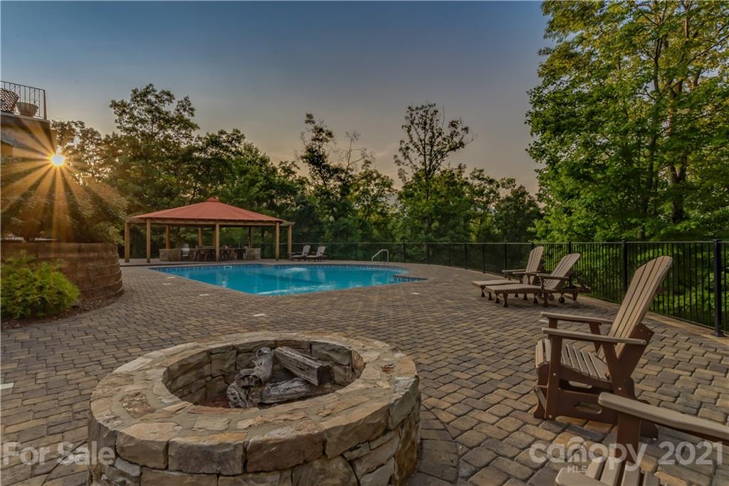 383 Silver Ridge Road Mill Spring, NC 28756 - Photo 6 of 46 a view of a backyard with furniture and tub