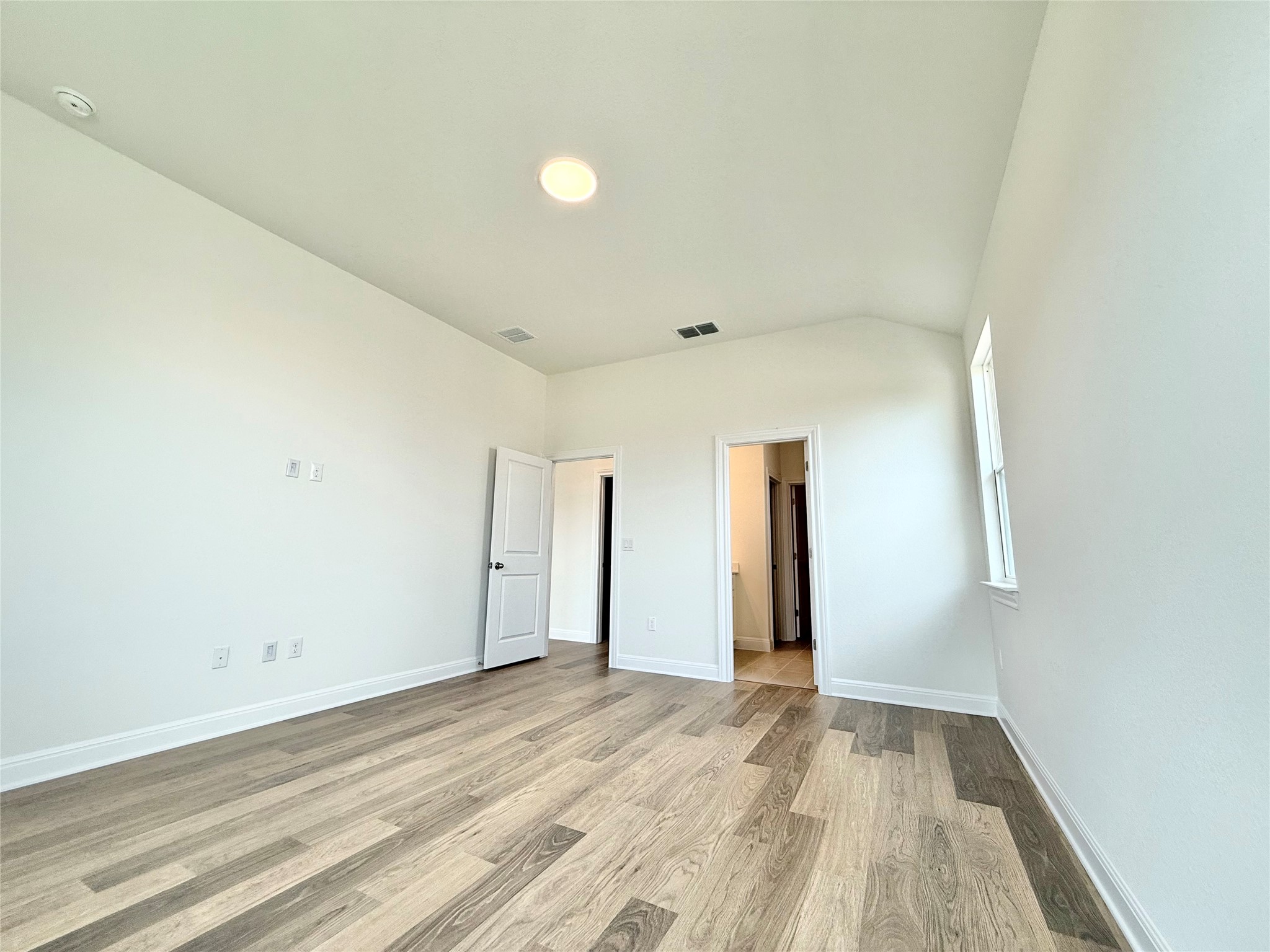 461 Young Street Buda, TX 78610 - Photo 17 of 32 a view of hallway with wooden floor